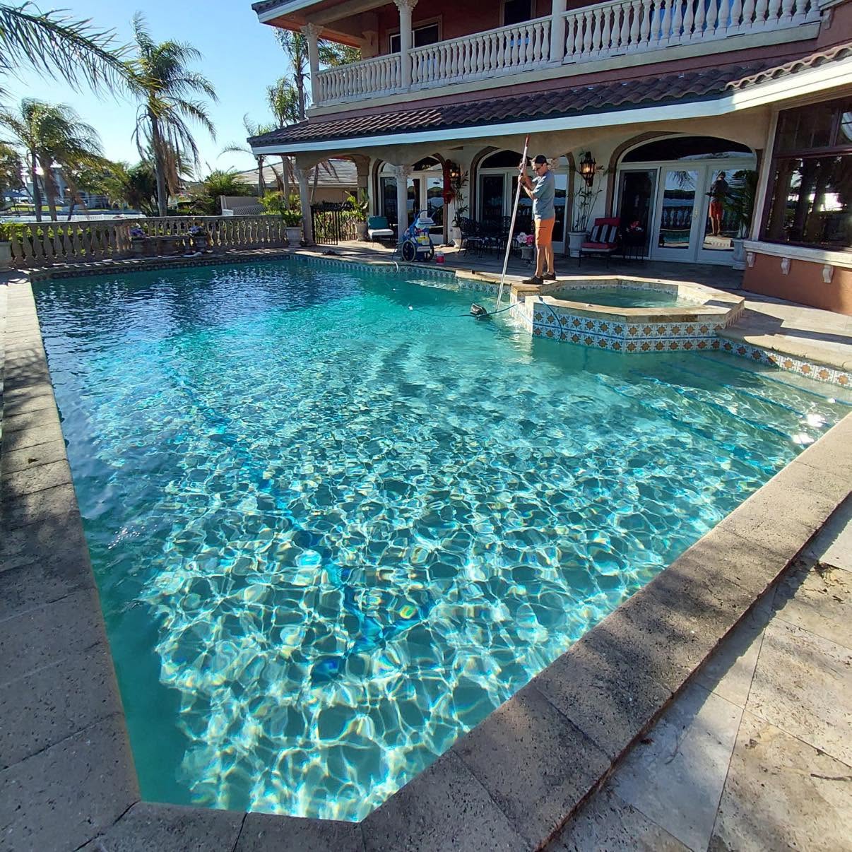 Crystal clear waterfront pool serviced by Clear Waters in Clearwater, FL